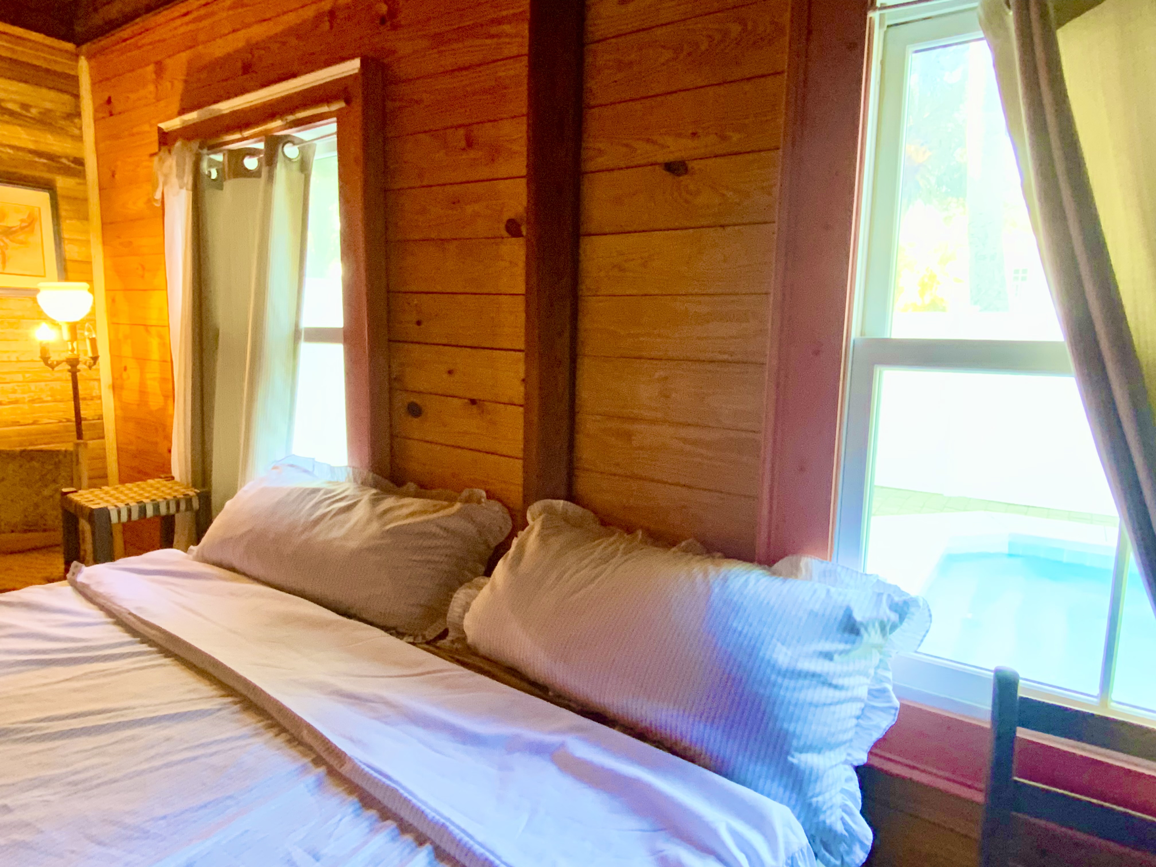 King bedroom, cedar shelves and ceiling fan/3 windows