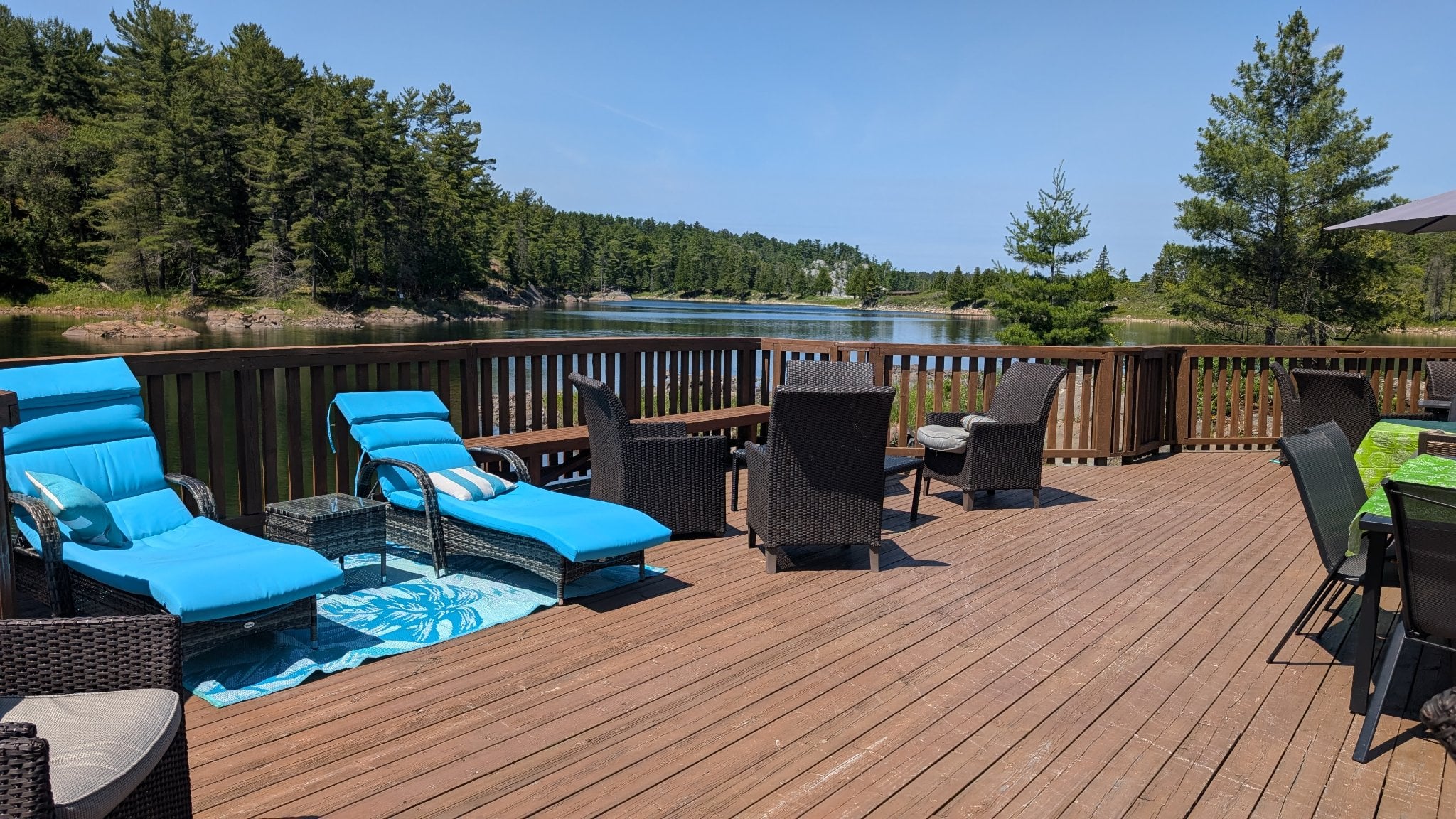 Sun deck with lounge chairs and stunning river views